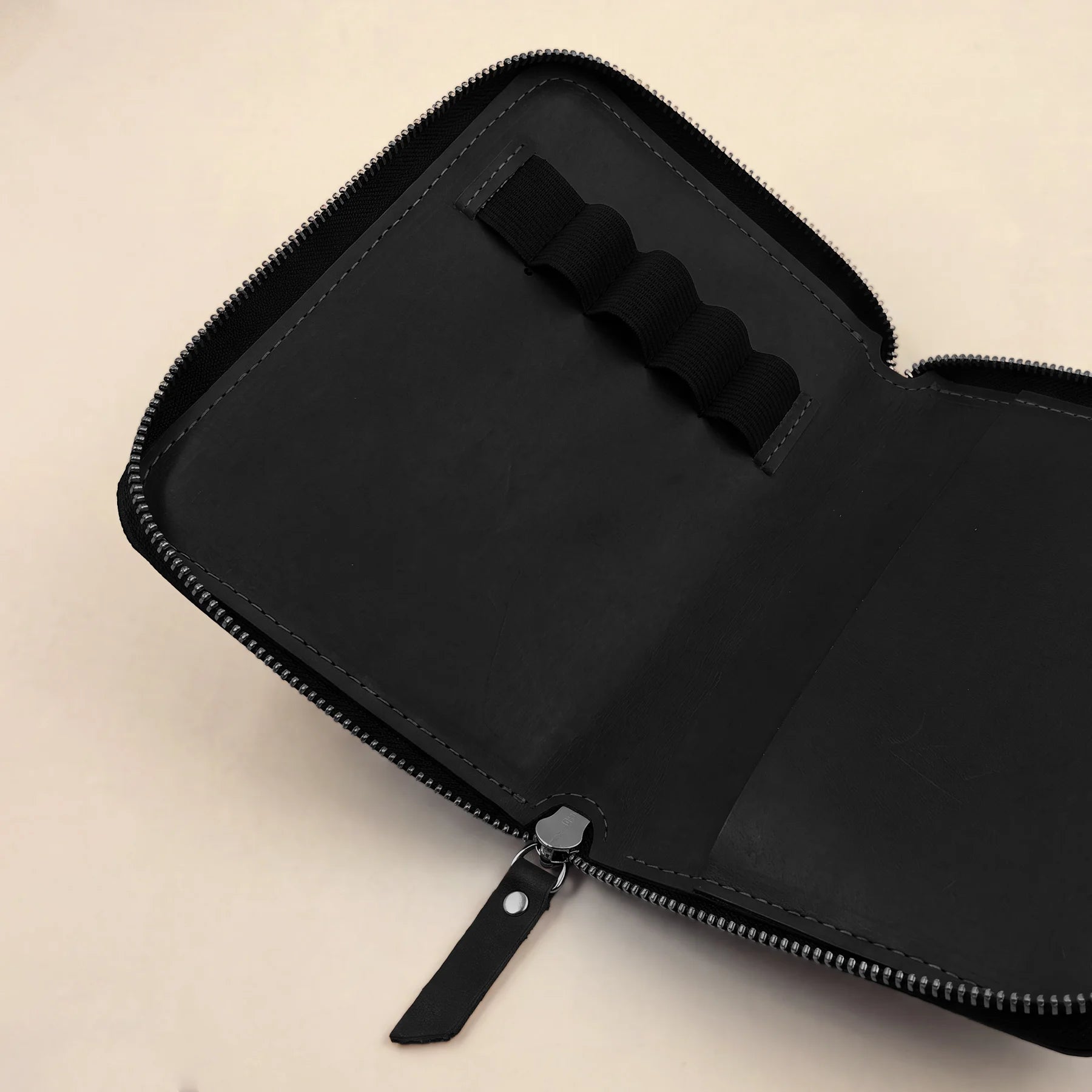 Leather pen protector case featuring quality zipper and handcrafted artisan finish.