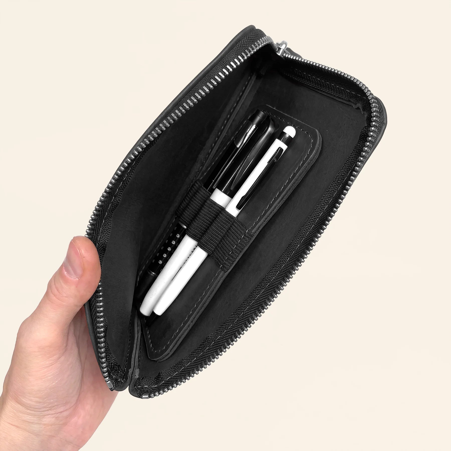 Premium leather zip pouch for securely carrying pens wherever inspiration strikes.