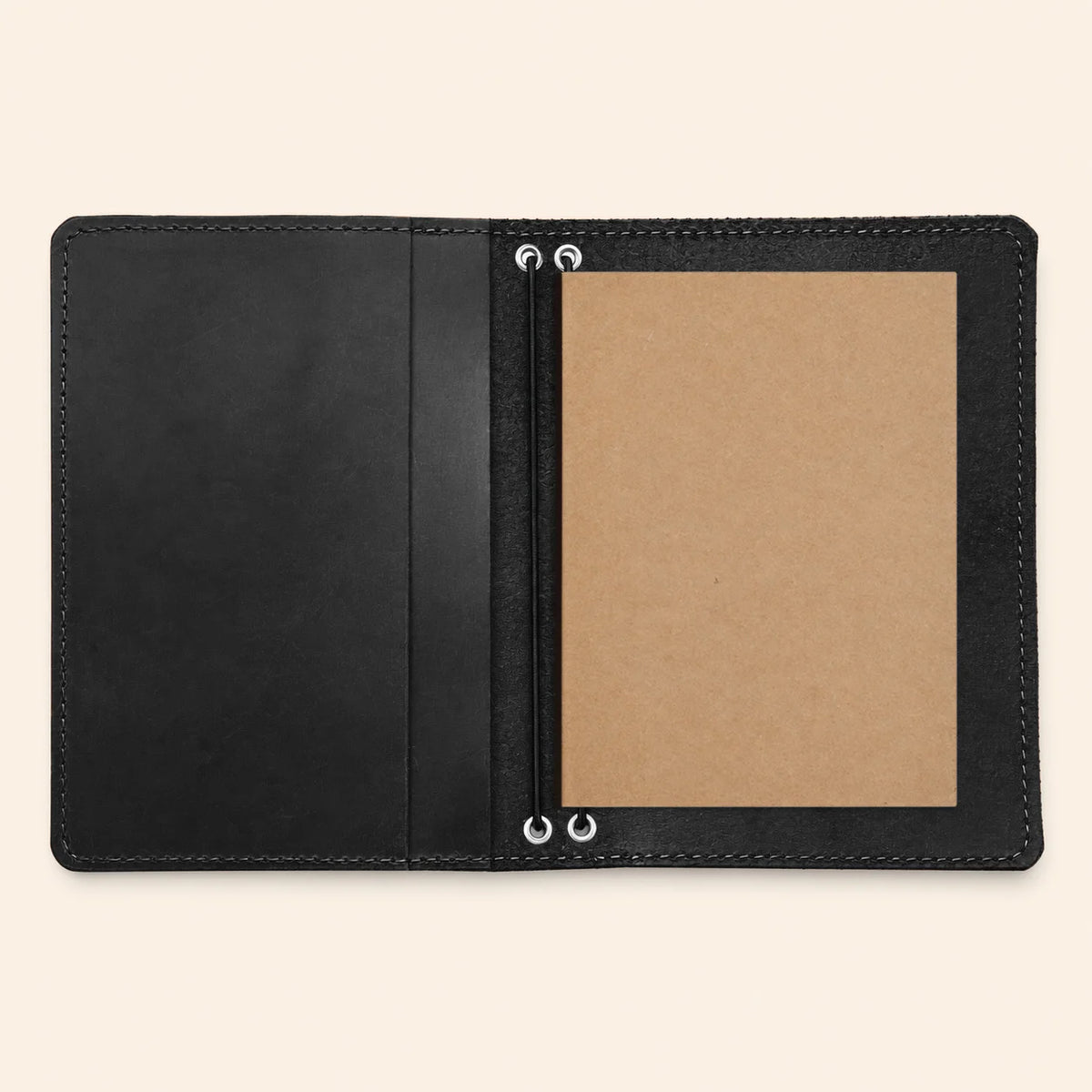 Handmade leather planner sleeve with twin elastic straps and convenient built-in storage pockets