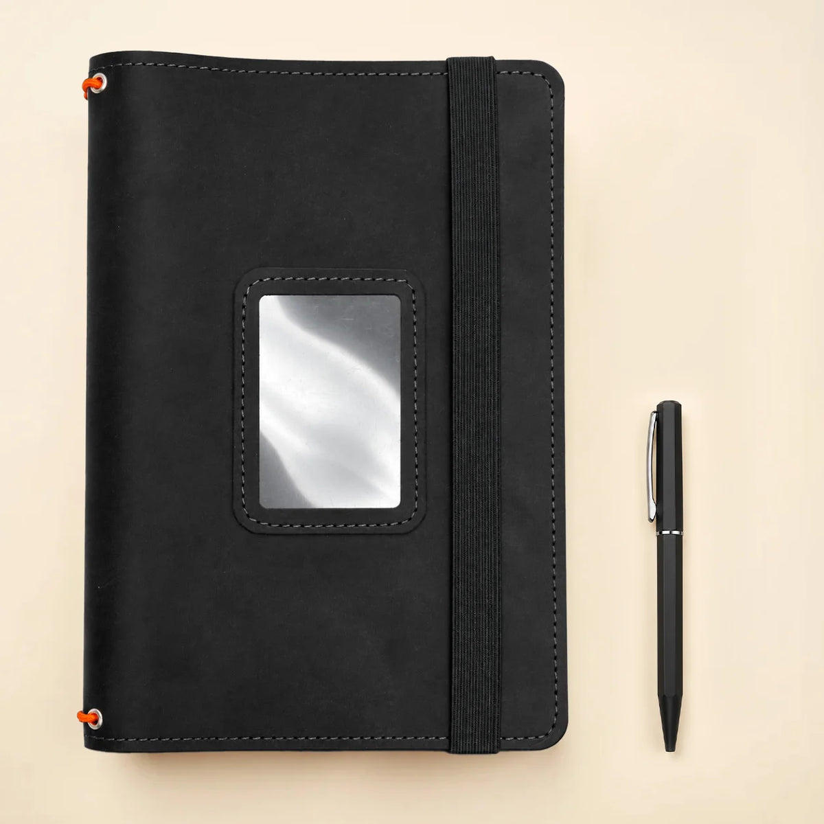Handmade leather notebook organizer with three elastic straps and practical pockets for everyday use.