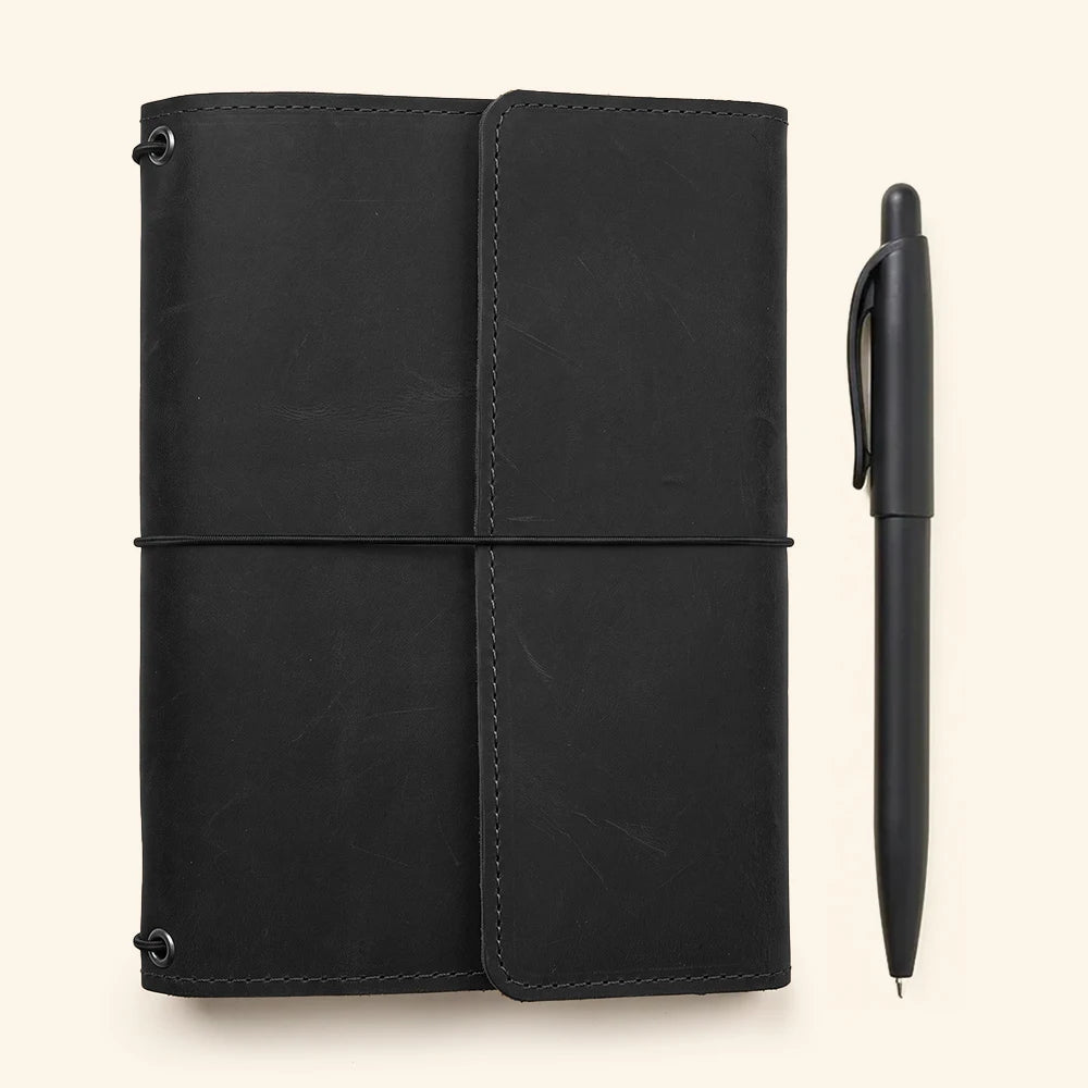 Elegant leather refillable notebook cover with durable craftsmanship and functional interior storage layout.