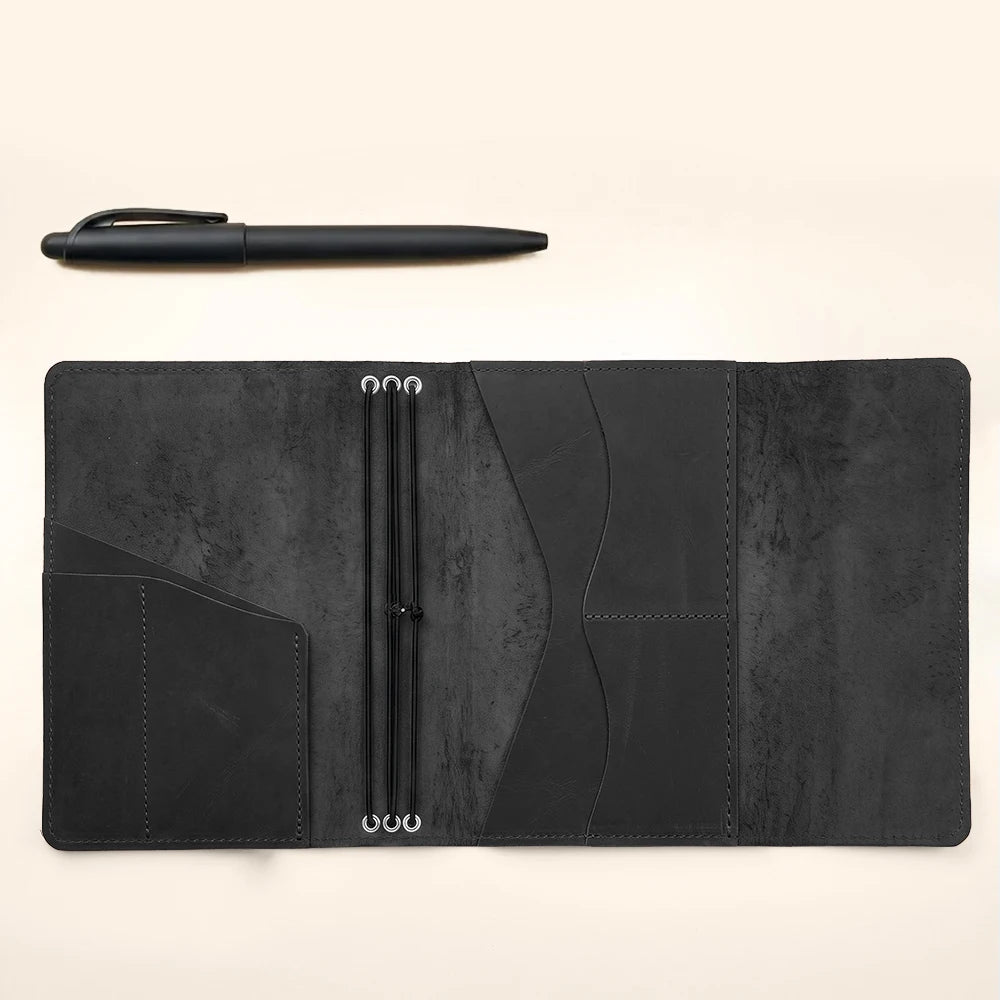 Minimalist leather notebook cover with refillable design, inner pockets, and secure elastic bands.