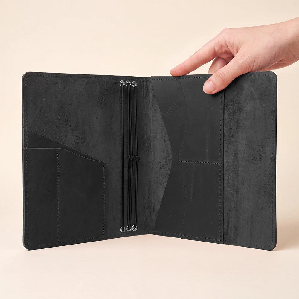 Leather notebook cover featuring three elastic bands, pen holder, and handcrafted premium construction.