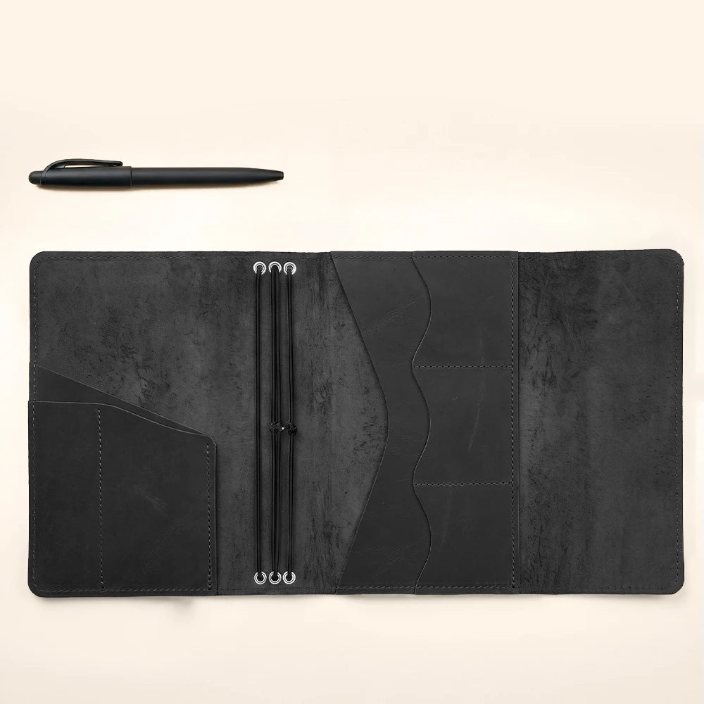 Refillable leather notebook cover featuring classic craftsmanship and functional everyday organization.