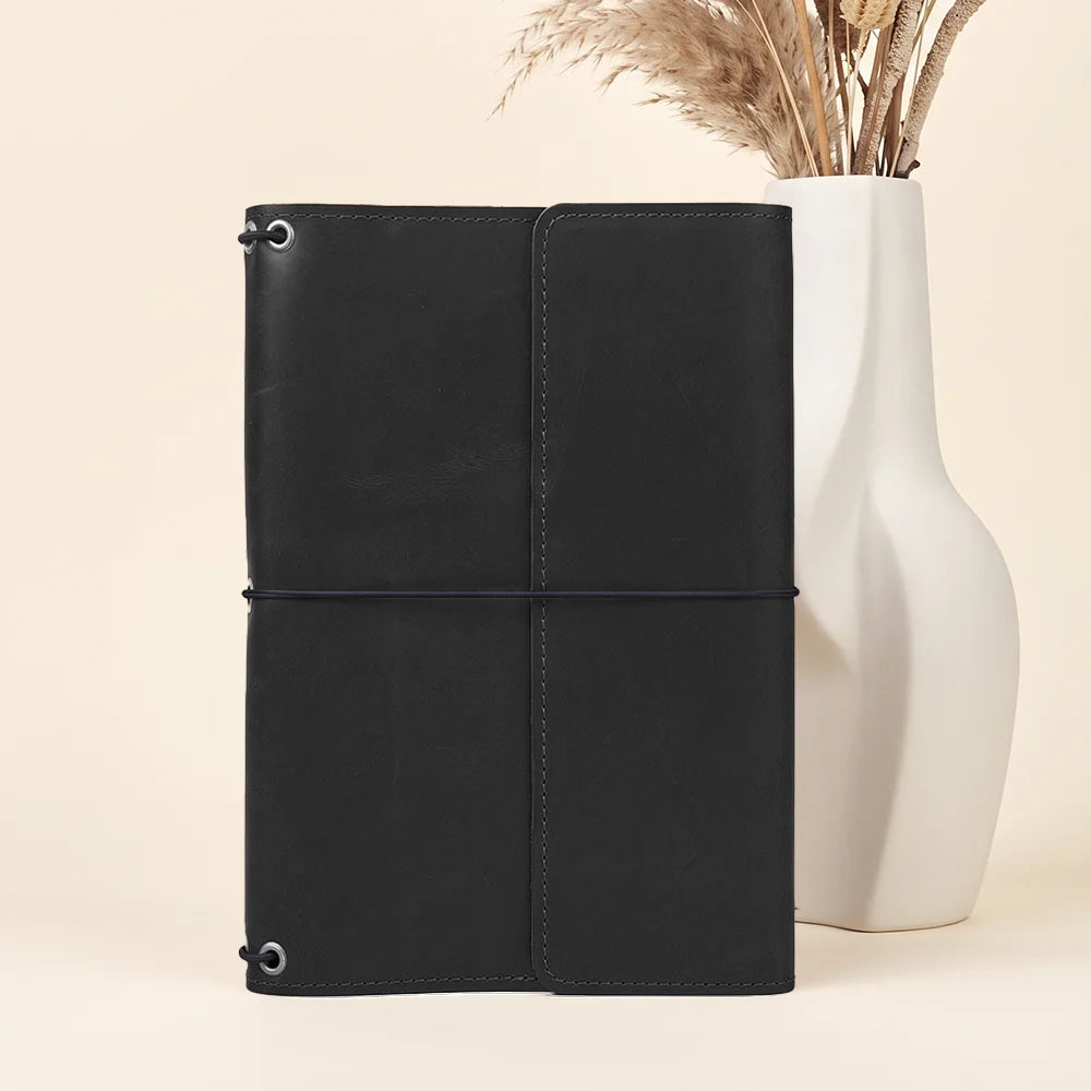 Refillable leather journal holder with durable elastic system and beautifully stitched leather finish.