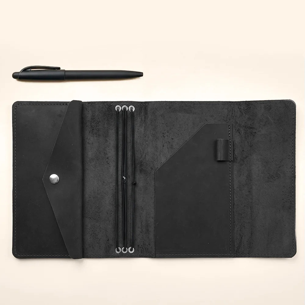 Handcrafted leather writing organizer with premium finish and flexible notebook insert retention bands.