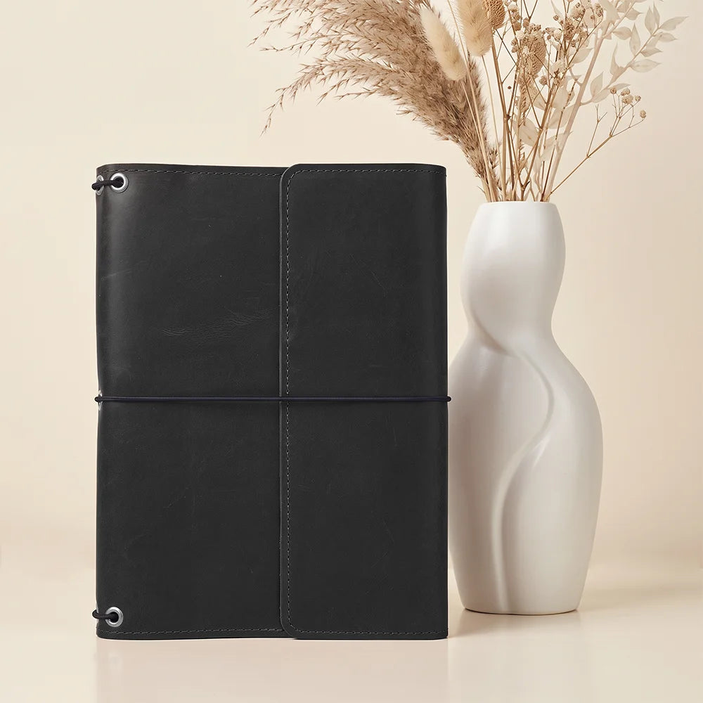 Refillable leather notebook organizer with premium leather, three elastic bands, and inner pockets.