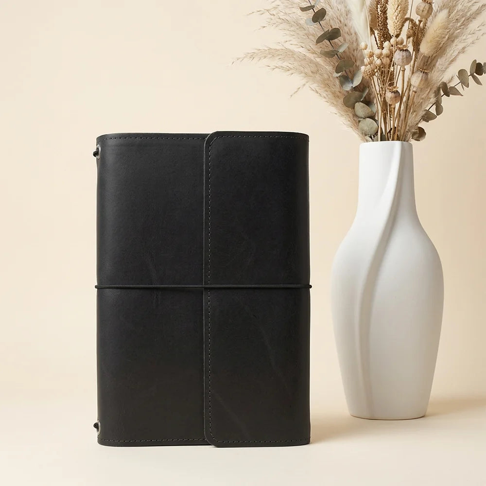 Handmade leather journal cover with interior compartments and a reliable pen holder