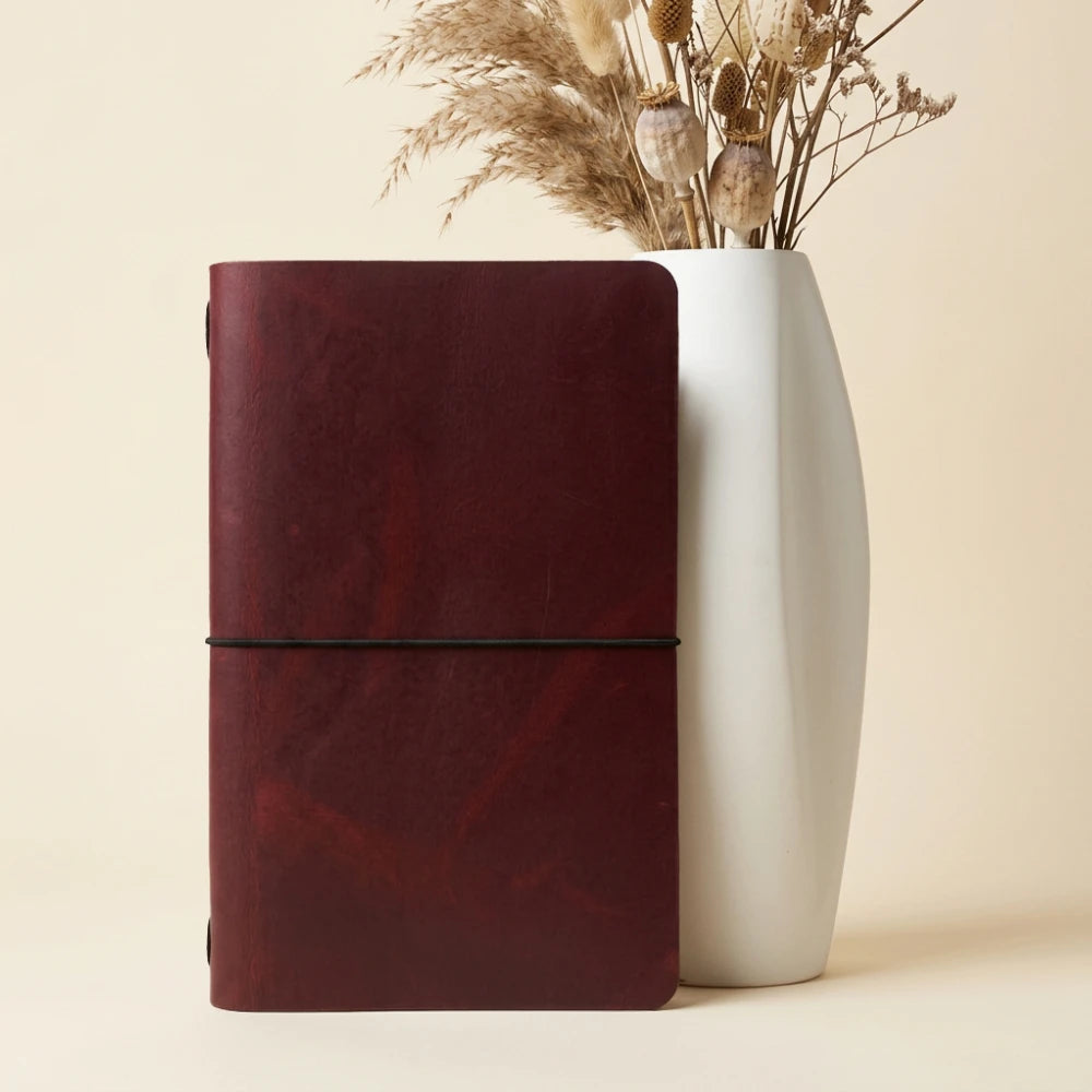 Minimalist journal cover showcasing genuine leather texture and a neatly fitted notebook.