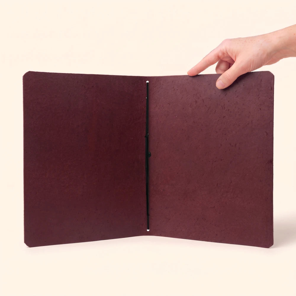 Leather writing organizer with simple construction and one elastic loop inside.