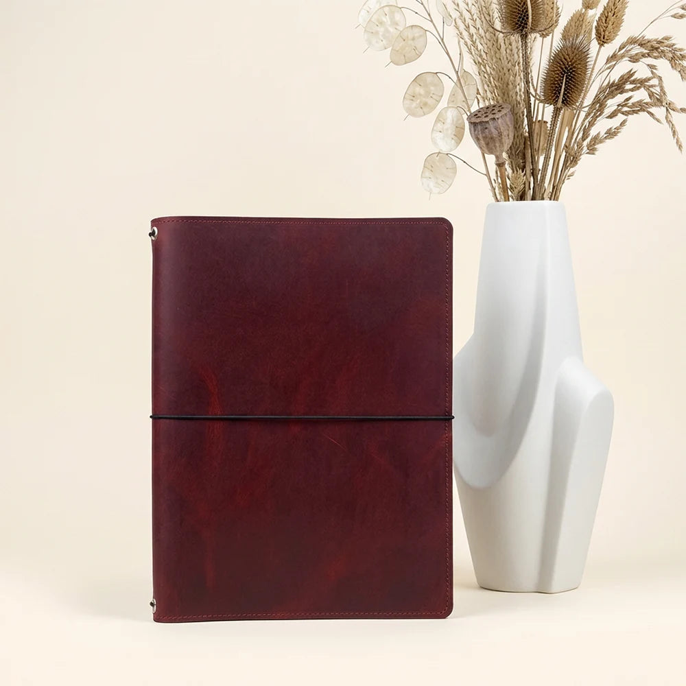 Leather notebook portfolio designed to carry refillable journals without unnecessary bulk.