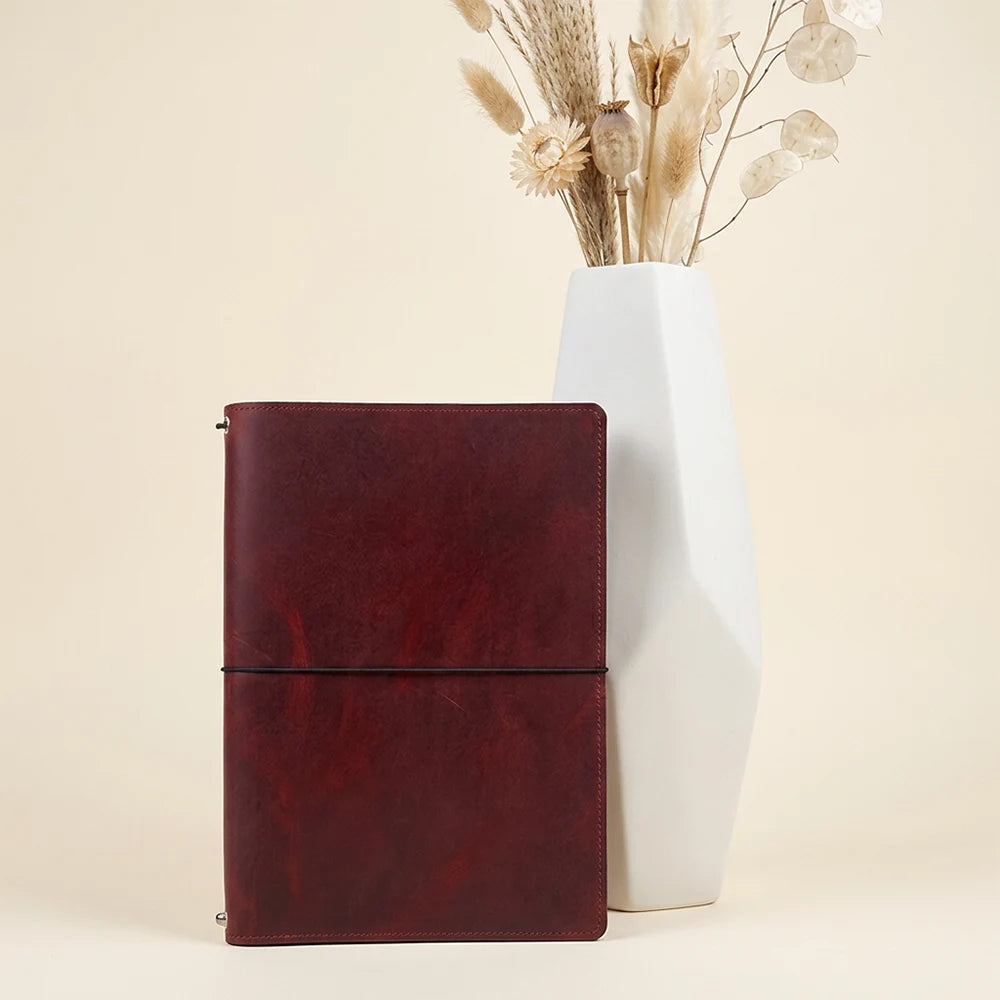 Natural leather notebook cover featuring organized storage and three flexible elastic bands.