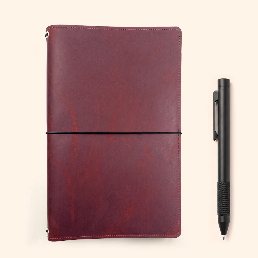 Detailed view inside a refillable leather cover with layered pockets and elastic loops.