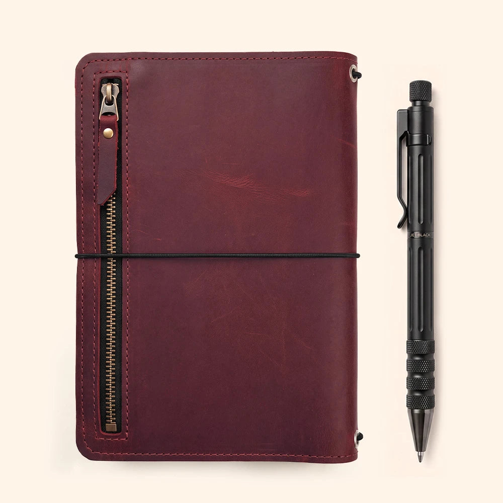 Rustic leather notebook organizer with carefully stitched interior sleeves and pen loop.