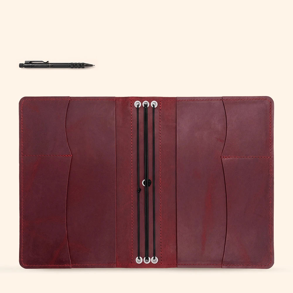 Classic leather notebook organizer with premium craftsmanship and built-in accessory storage.