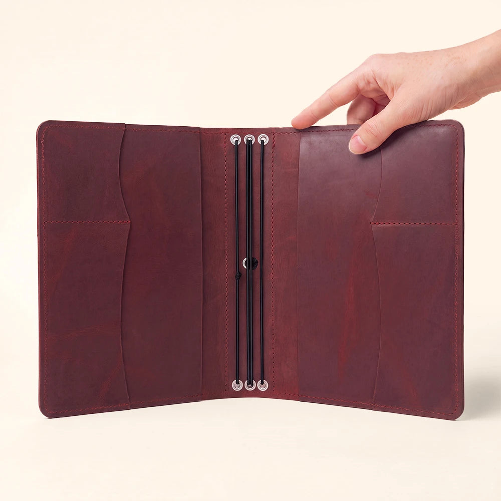 Leather notebook cover with premium craftsmanship, document pockets, and pen carrying loop.