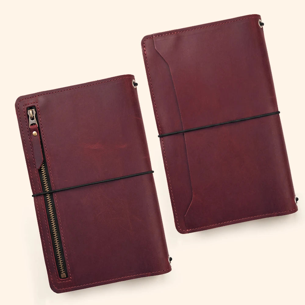 Handmade leather notebook folder offering interior compartments for organized daily carry.