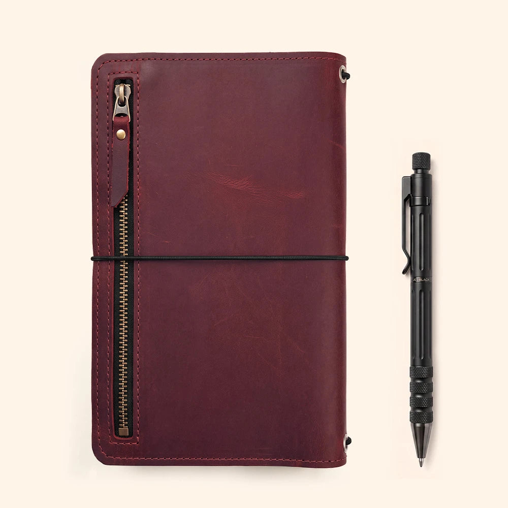 Refillable journal cover with organized leather interior for efficient everyday planning.
