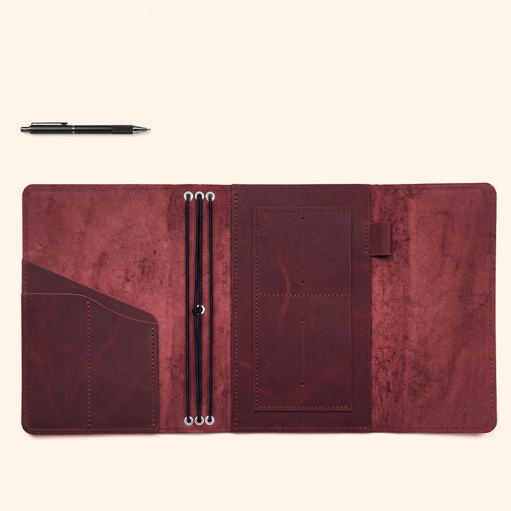 Refillable leather notebook portfolio designed with storage compartments and durable pen sleeve.
