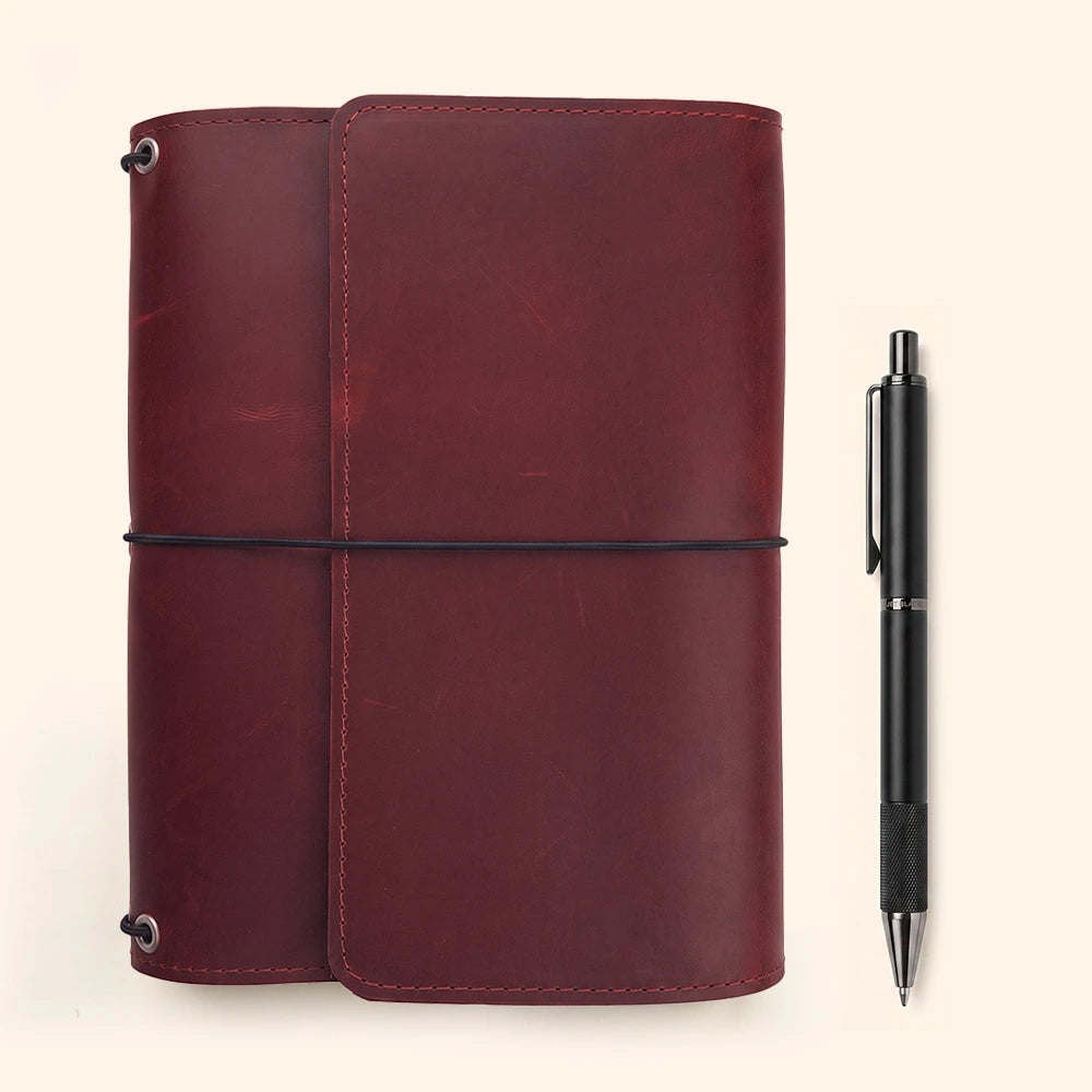 Elegant refillable journal cover with genuine leather finish and secure interior pen holder.