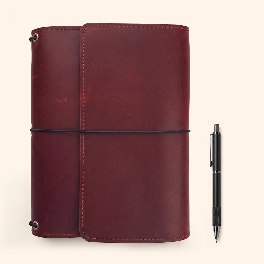 Natural leather notebook folio featuring stitched interior compartments and elegant pen storage loop.