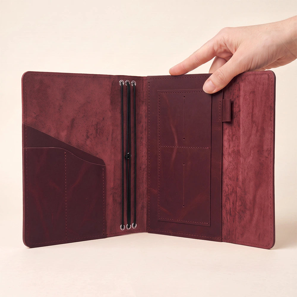 Elegant leather notebook cover featuring inside pockets and sturdy pen loop for notebooks.