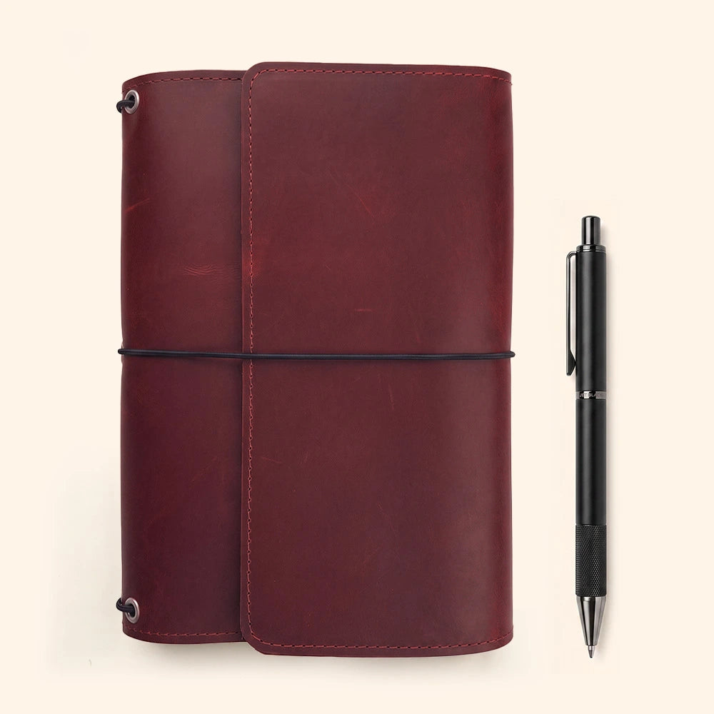 Genuine leather notebook organizer featuring spacious compartments and elegant stitched pen loop.
