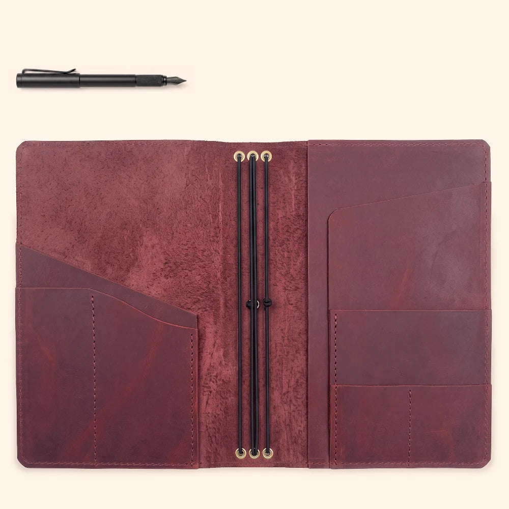 Leather wrap with triple elastic attachment points for modular journal organization.