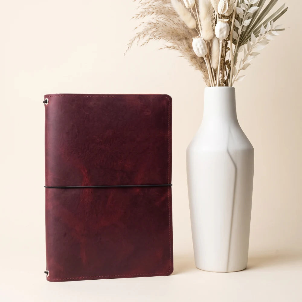 Premium genuine leather cover designed with three elastic straps for journal refills.