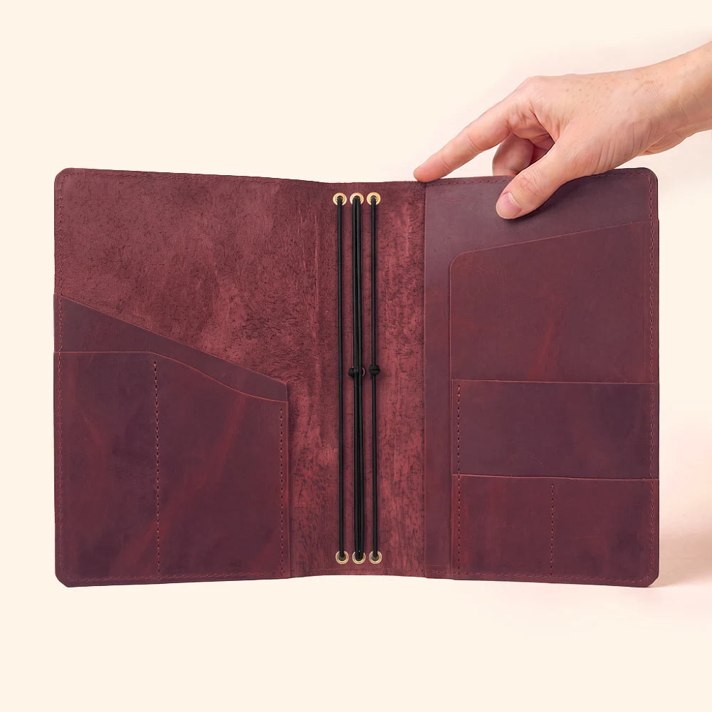 Handmade natural leather notebook case featuring three secure interior elastic bands.