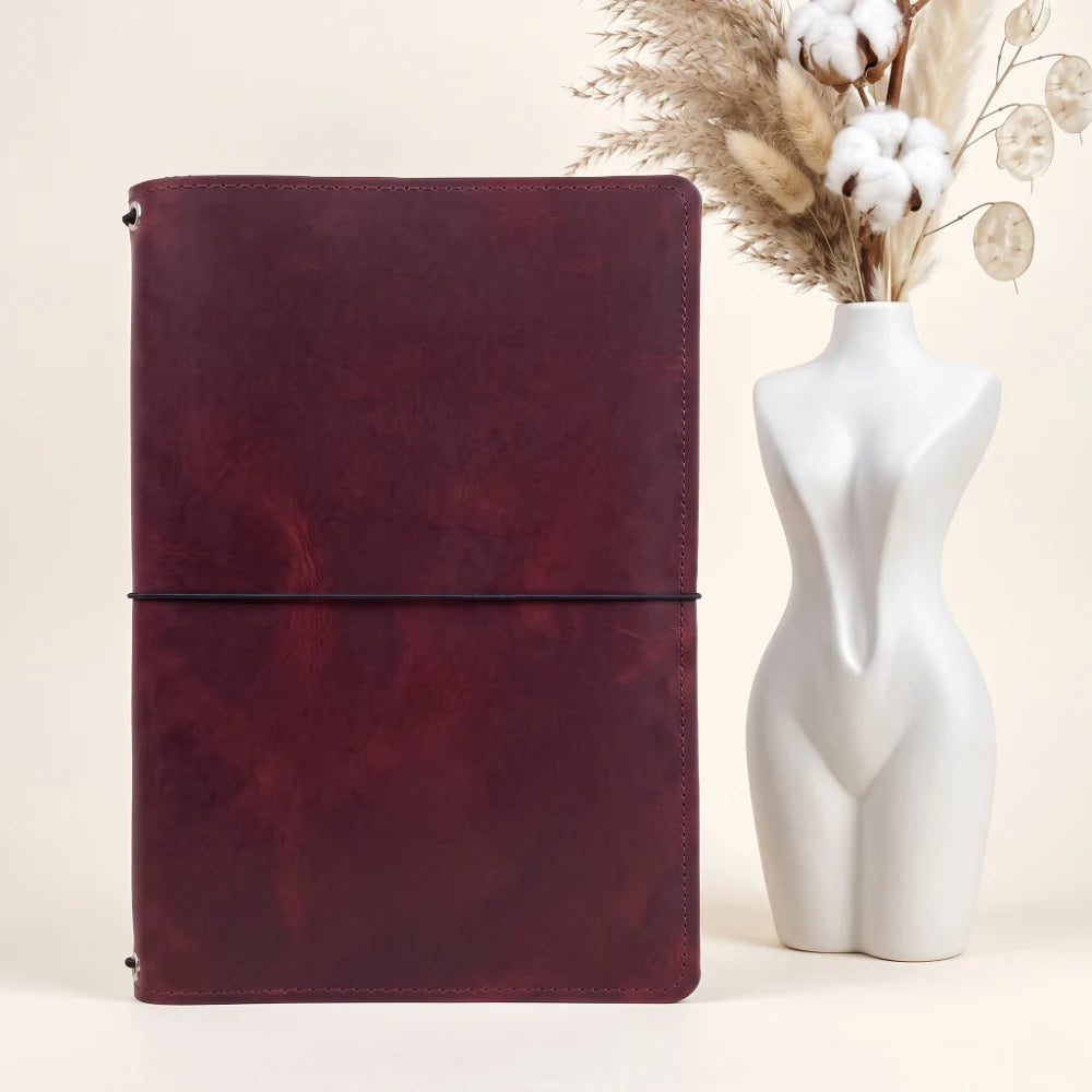 Premium genuine leather notebook cover featuring three bands for flexible insert storage.