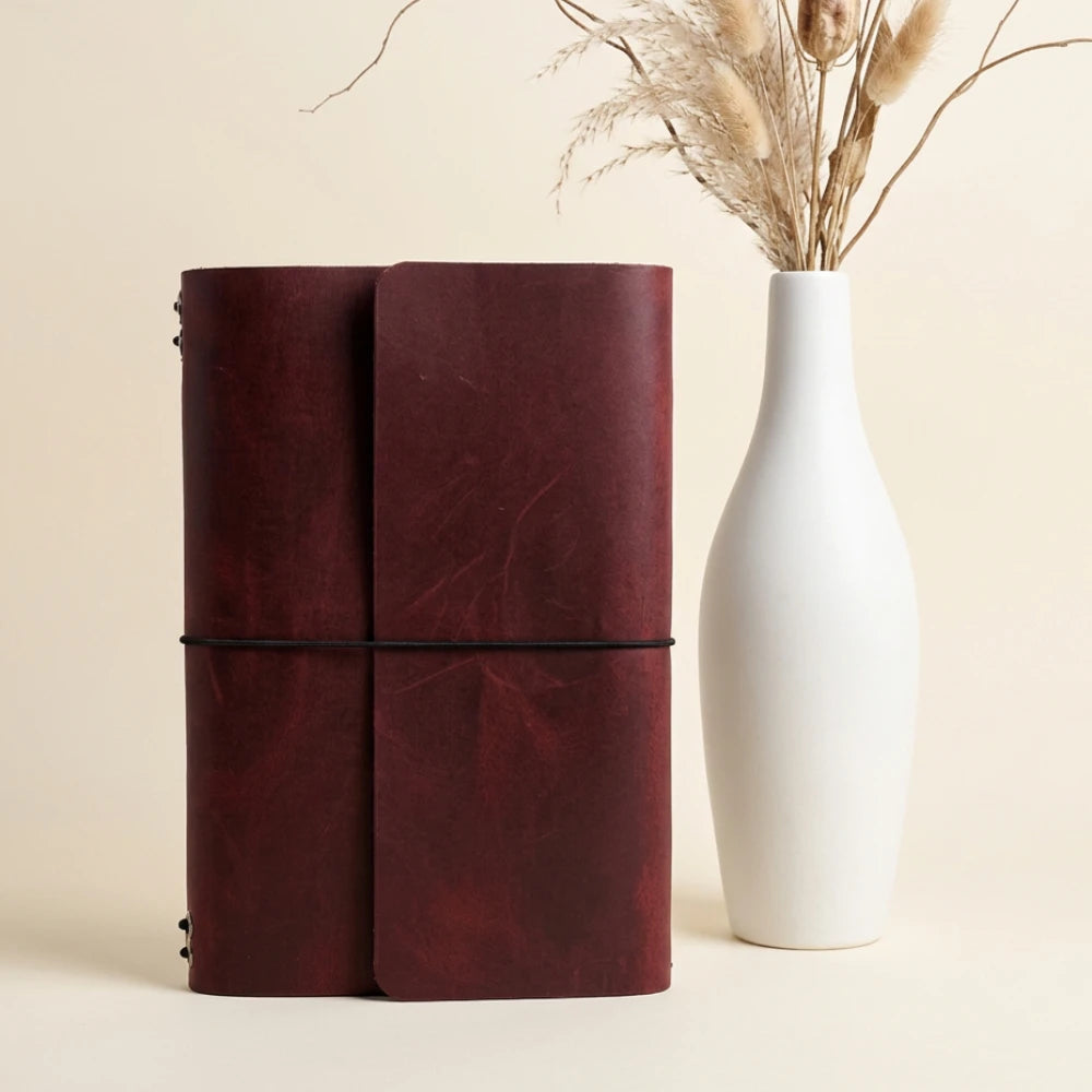 Reusable leather notebook binder designed with six stretch bands for flexible organization.