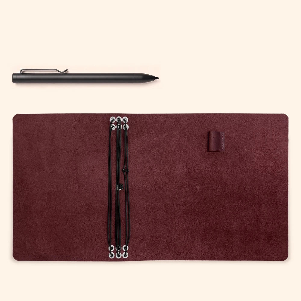 Refillable journal cover crafted from genuine leather with six elastic bands inside.