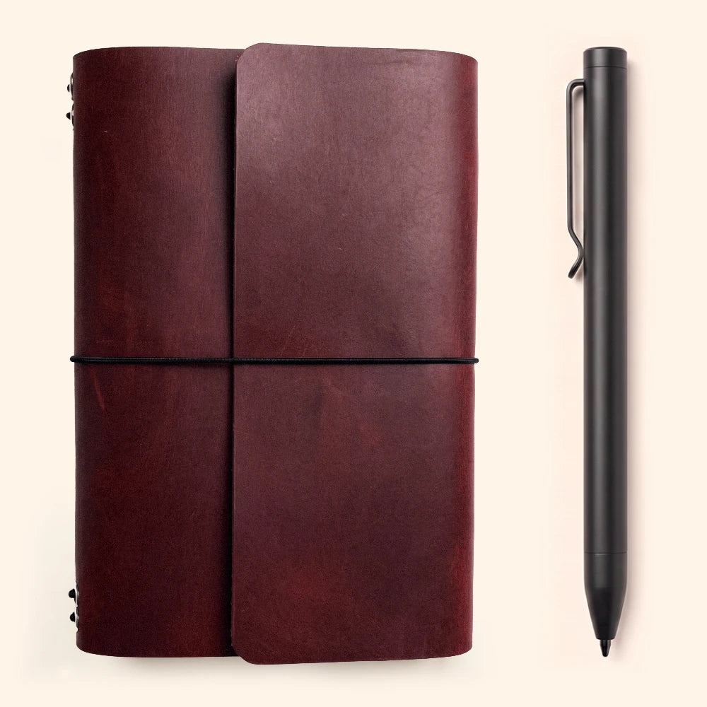Stylish leather journal organizer with six elastic bands and an exterior pen loop.