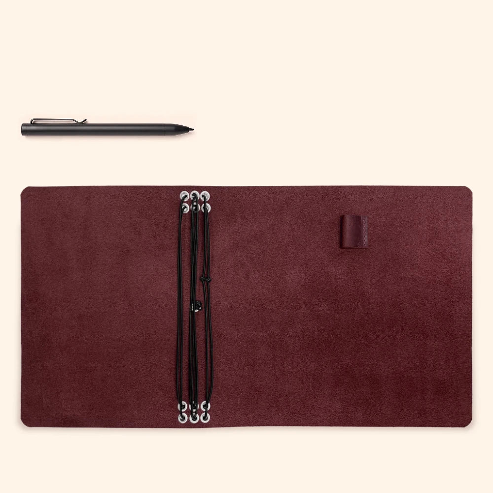 Versatile leather journal binder featuring six elastic attachment points and pen loop.