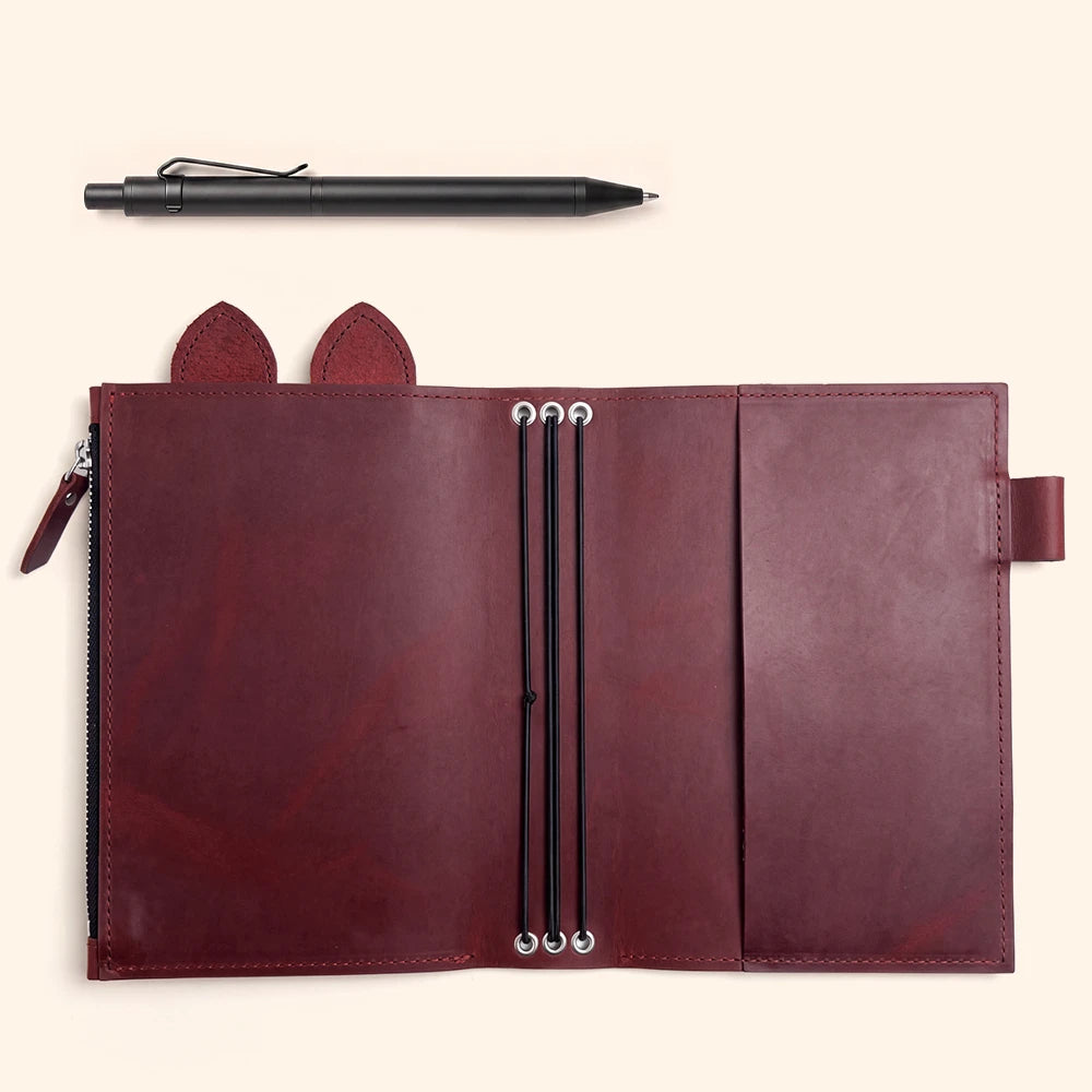 Genuine leather journal organizer featuring zipper compartment, pen loop, leather ears, and three elastic bands.