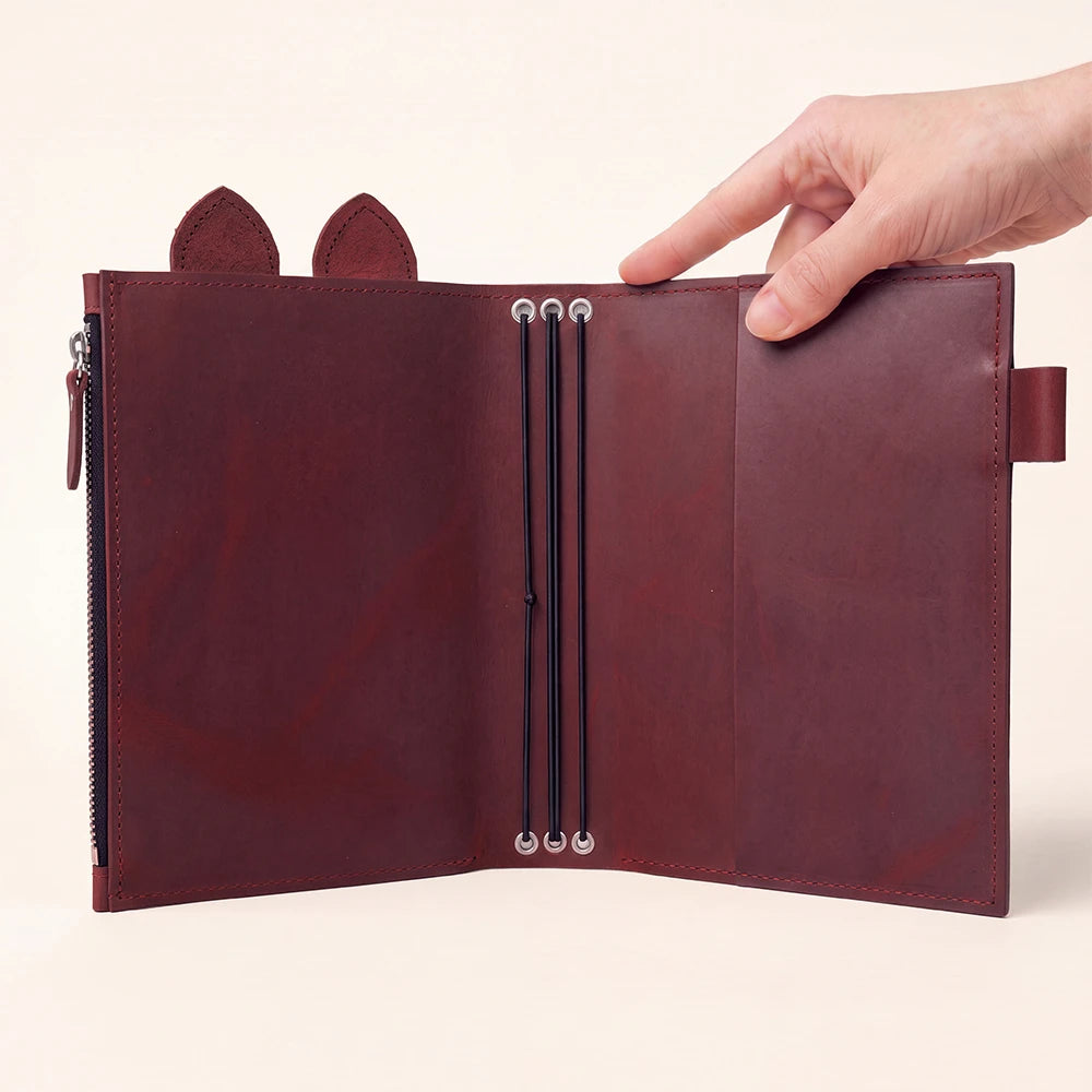 Natural leather planner cover with large zip pocket, pen holder, leather ears, and elastic bands.