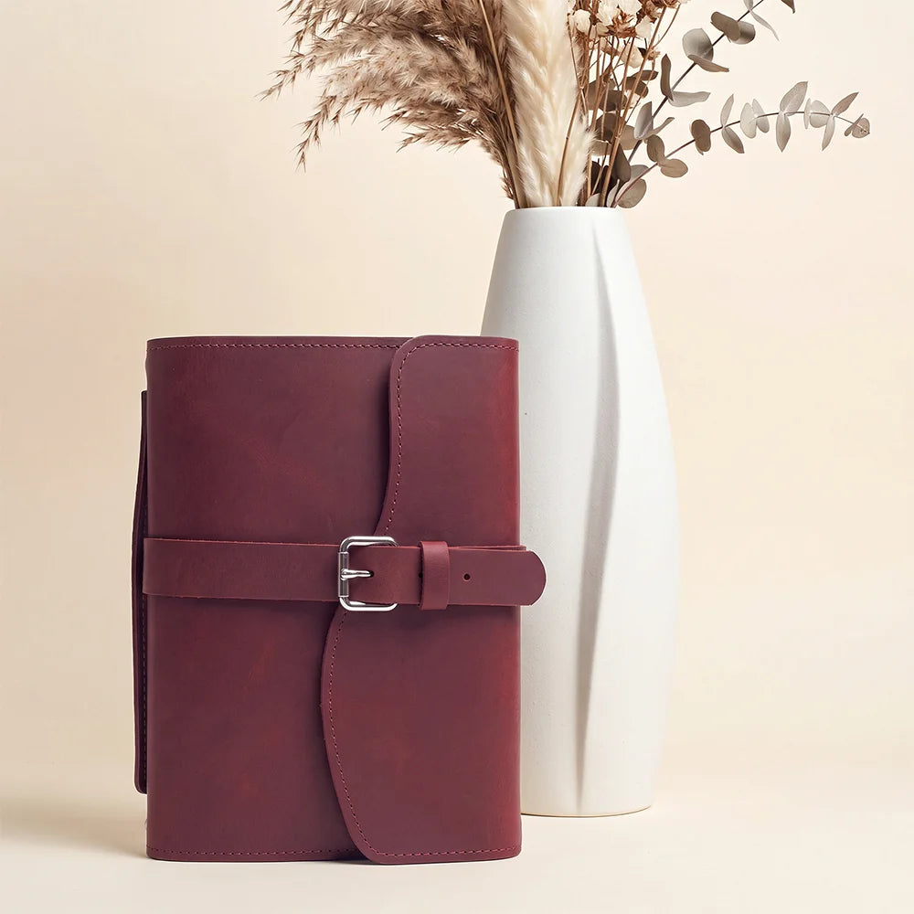 Natural leather notebook case featuring useful inner compartments, pen loop, attached bookmark, and durable handle.