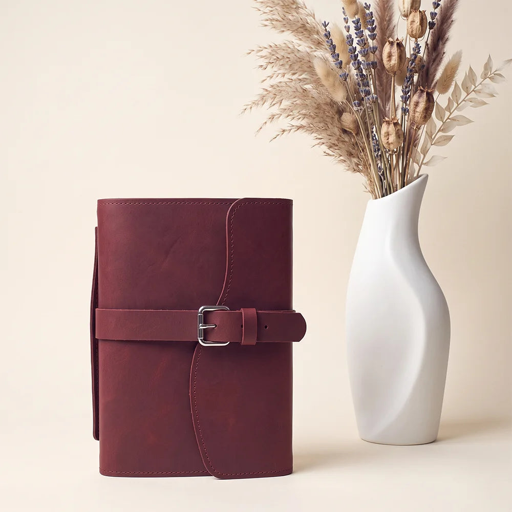Handcrafted journal holder with genuine leather, useful pockets, pen loop, ribbon bookmark, and outer handle.