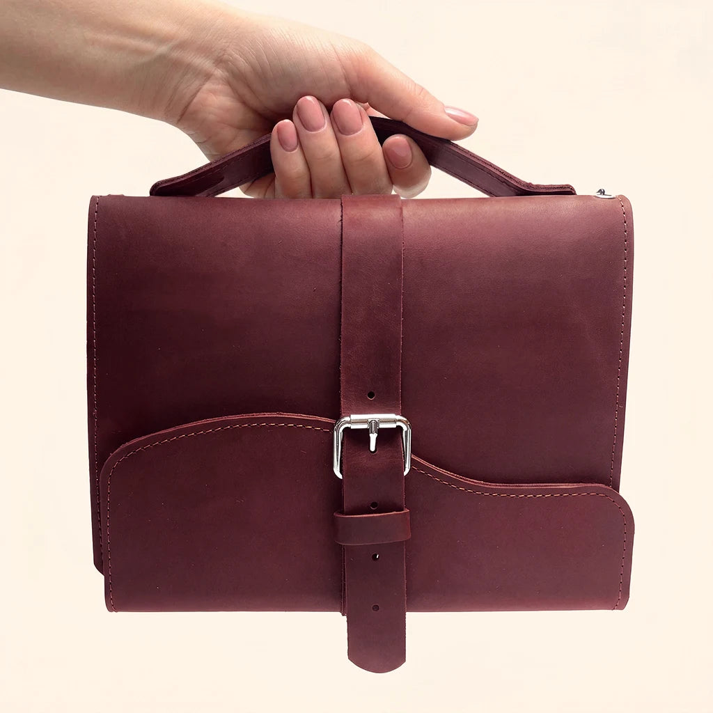 Leather traveler's notebook cover with three elastic inserts and an easy carrying strap.