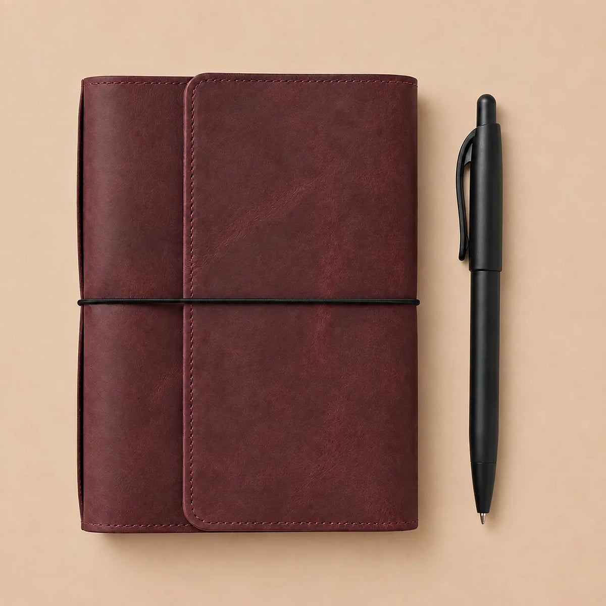 Burgundy leather journal cover featuring six elastic bands, practical pockets, zipper pocket, and pen loop.