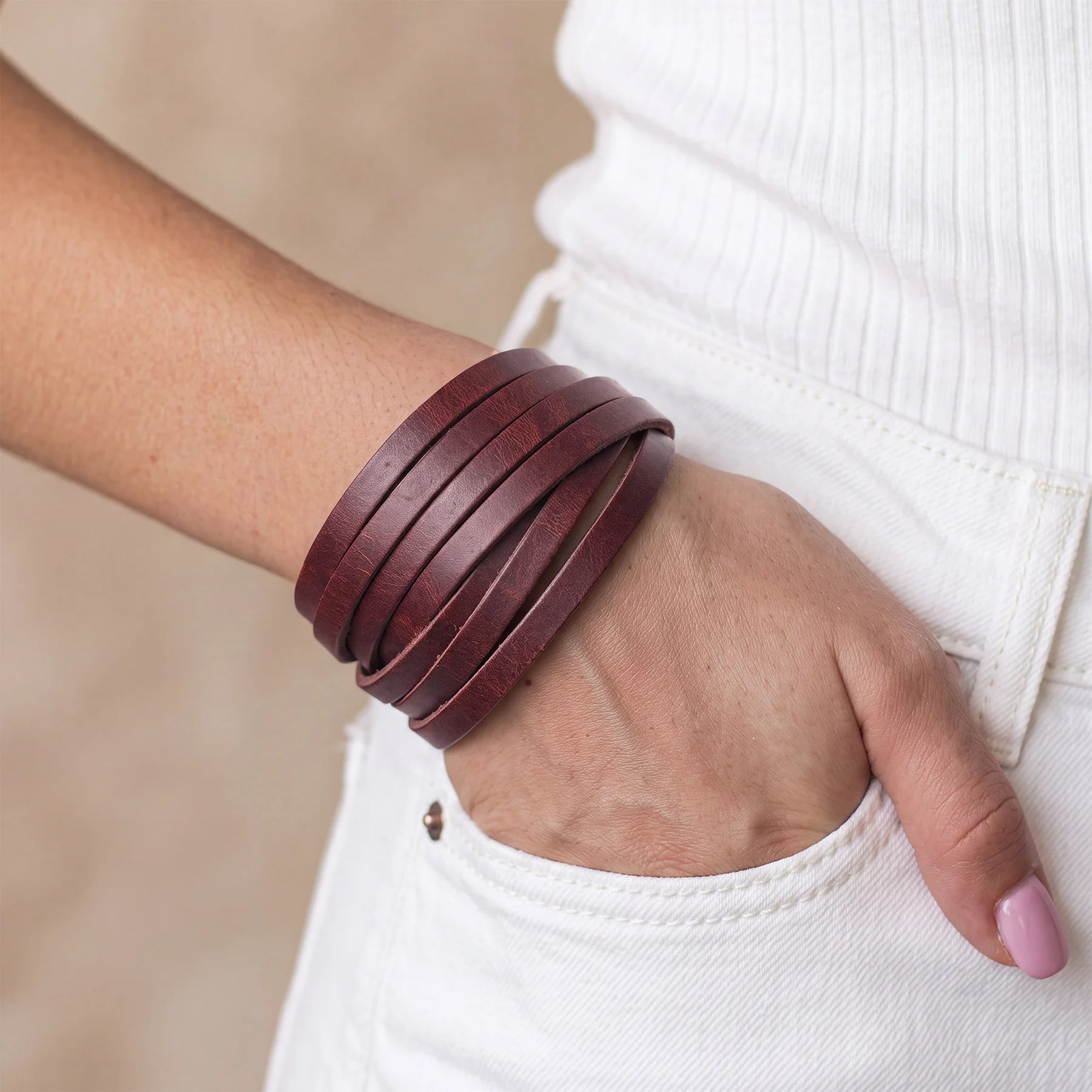 Classic handmade leather bracelet with secure metal snap closure and rustic handcrafted appeal.