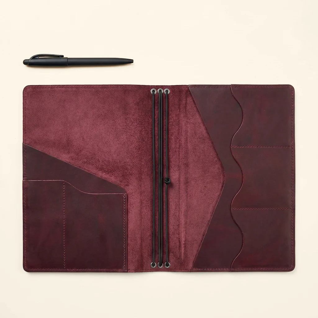 Handmade leather journal organizer with versatile storage and insert system.