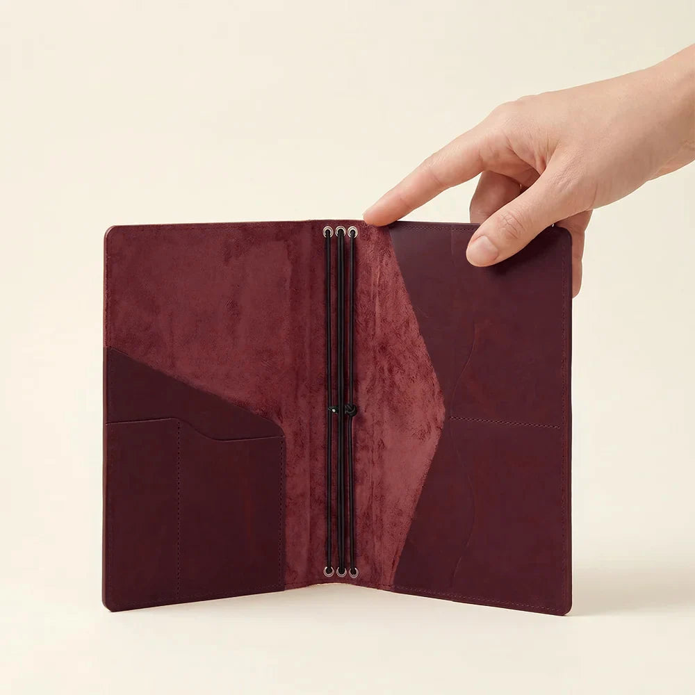 Genuine leather journal cover with practical pockets and secure three elastic band design.