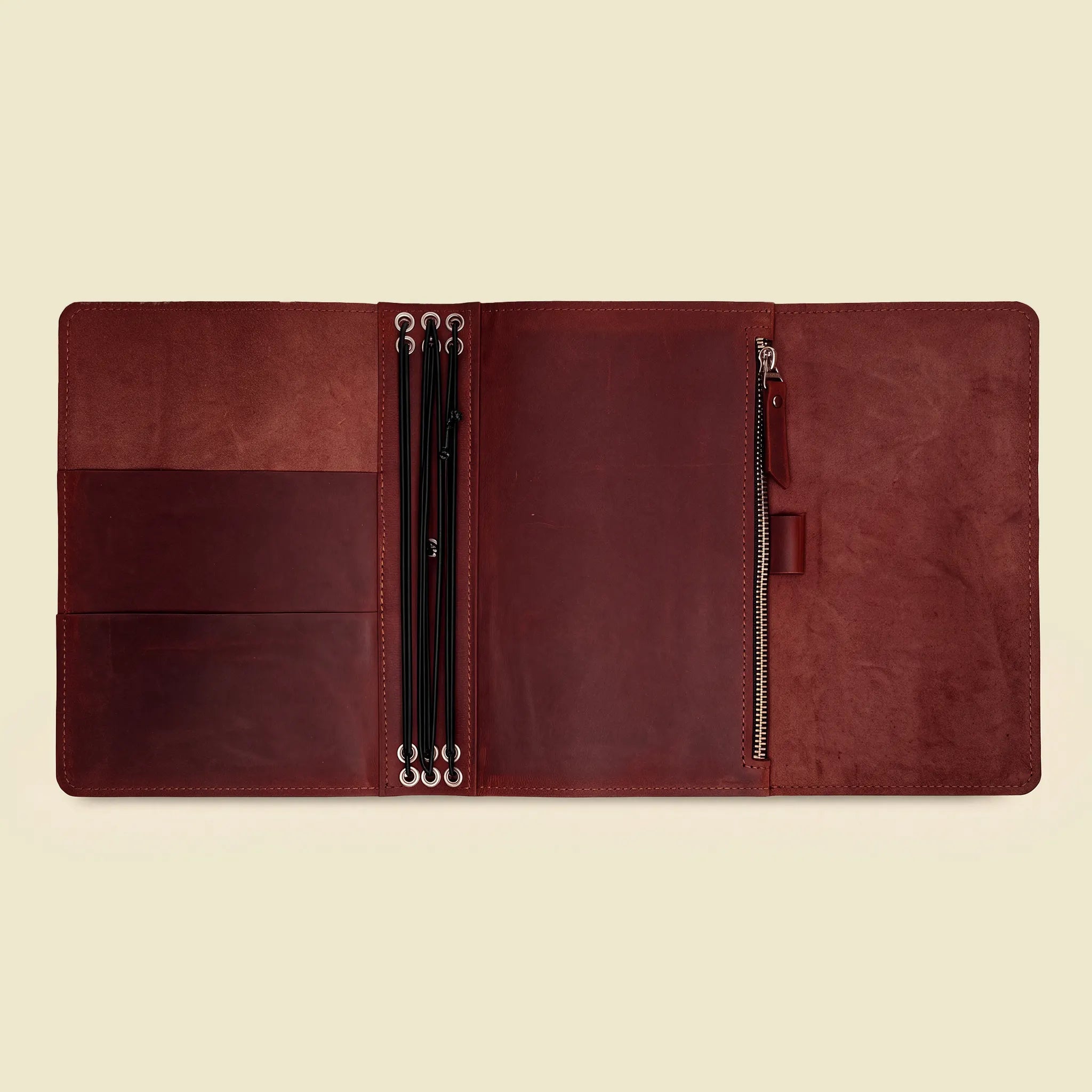 Natural leather organizer cover crafted for interchangeable journals and everyday stationery.