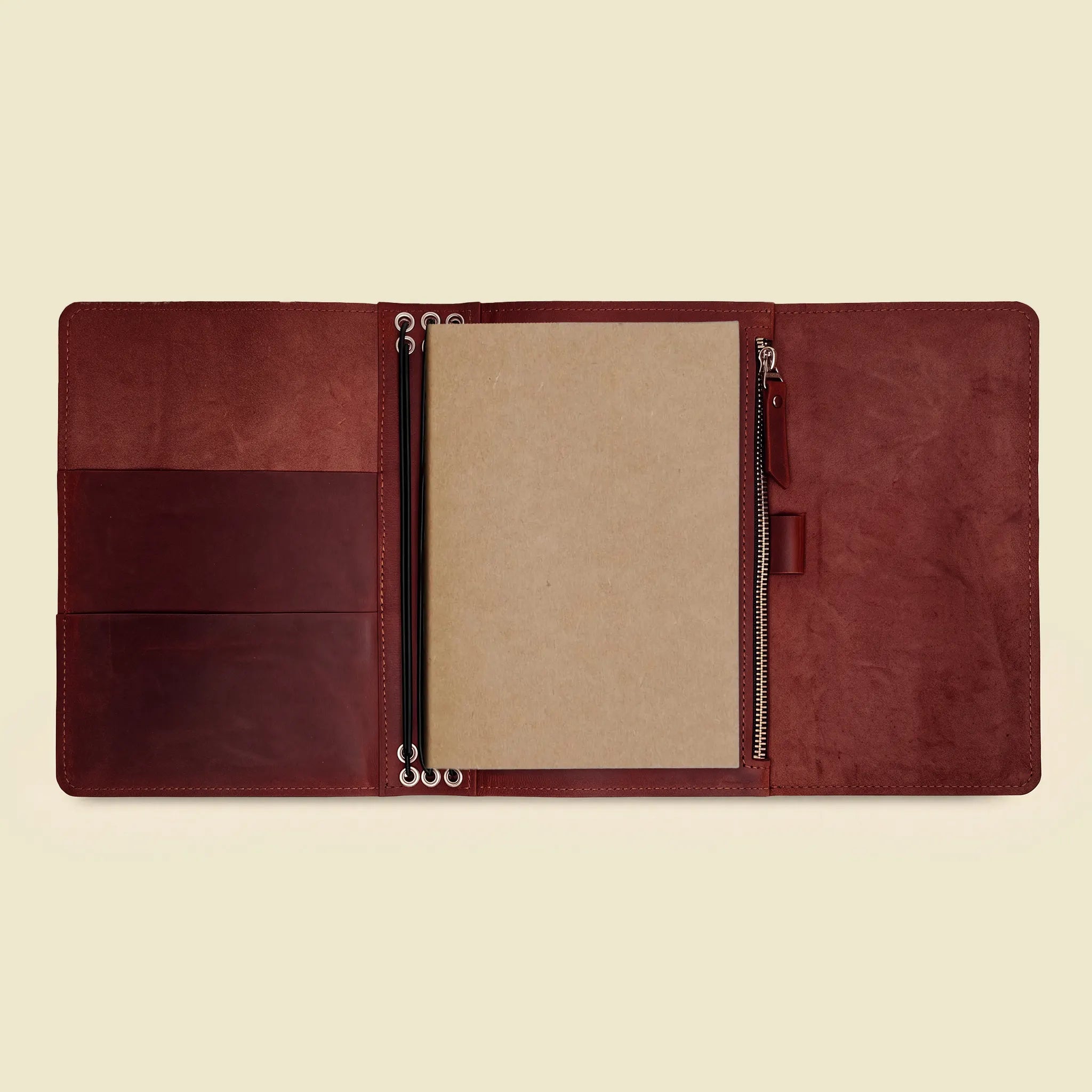 Genuine leather refillable notebook holder showing organized pockets and flexible insert loops