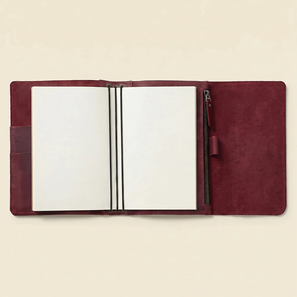 Premium handmade leather cover with practical pockets and pen holder.
