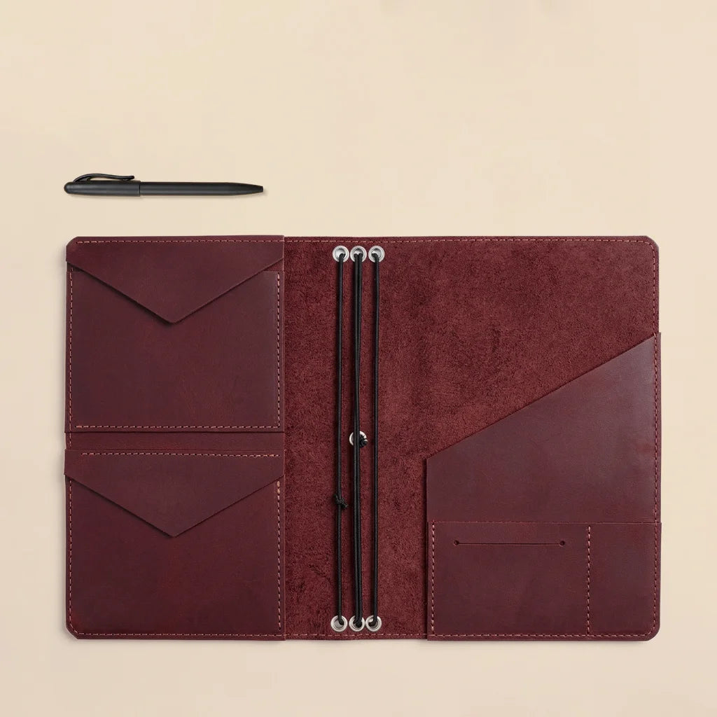 Genuine leather journal cover showcasing interior organizer layout and durable elastic system.