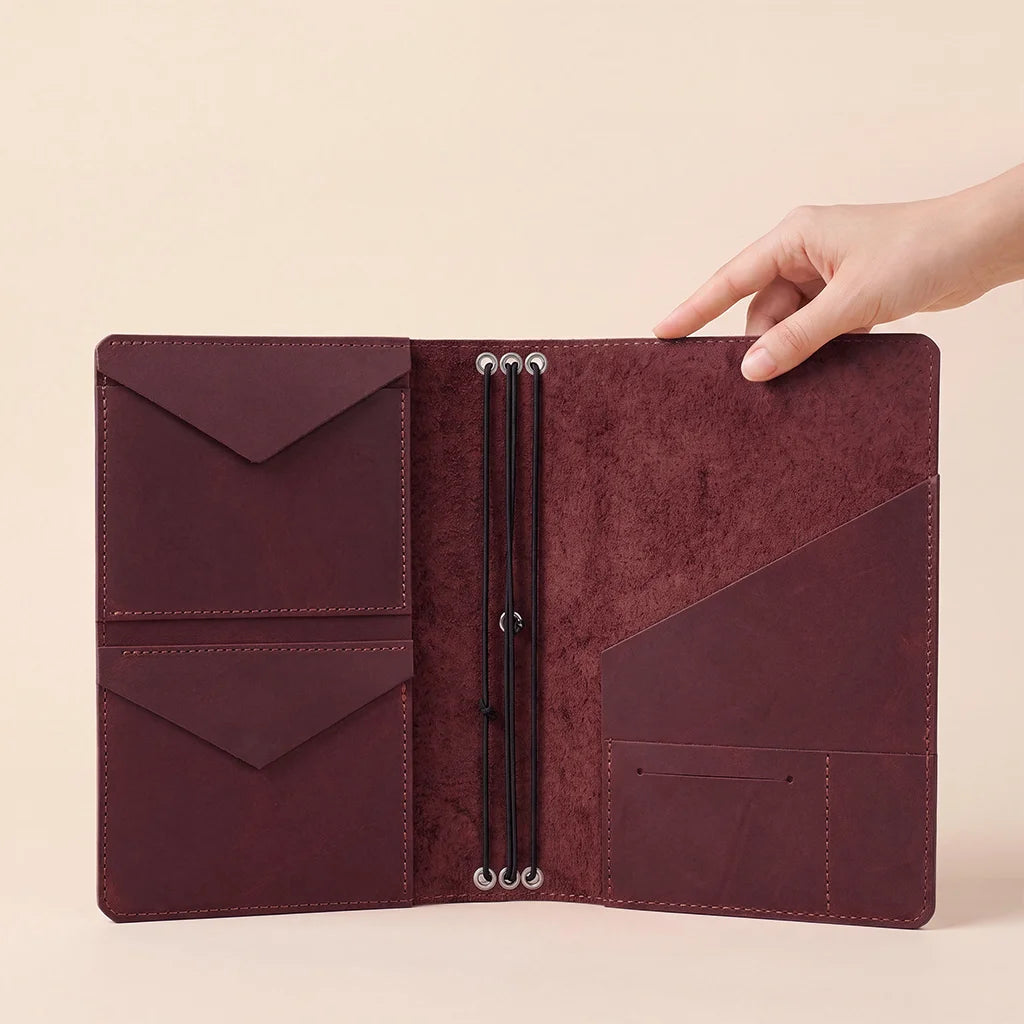 Genuine leather journal cover designed with practical pockets and secure notebook elastic holders.