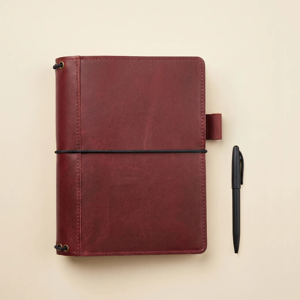 Leather notebook case with five elastic cords and functional organizer features